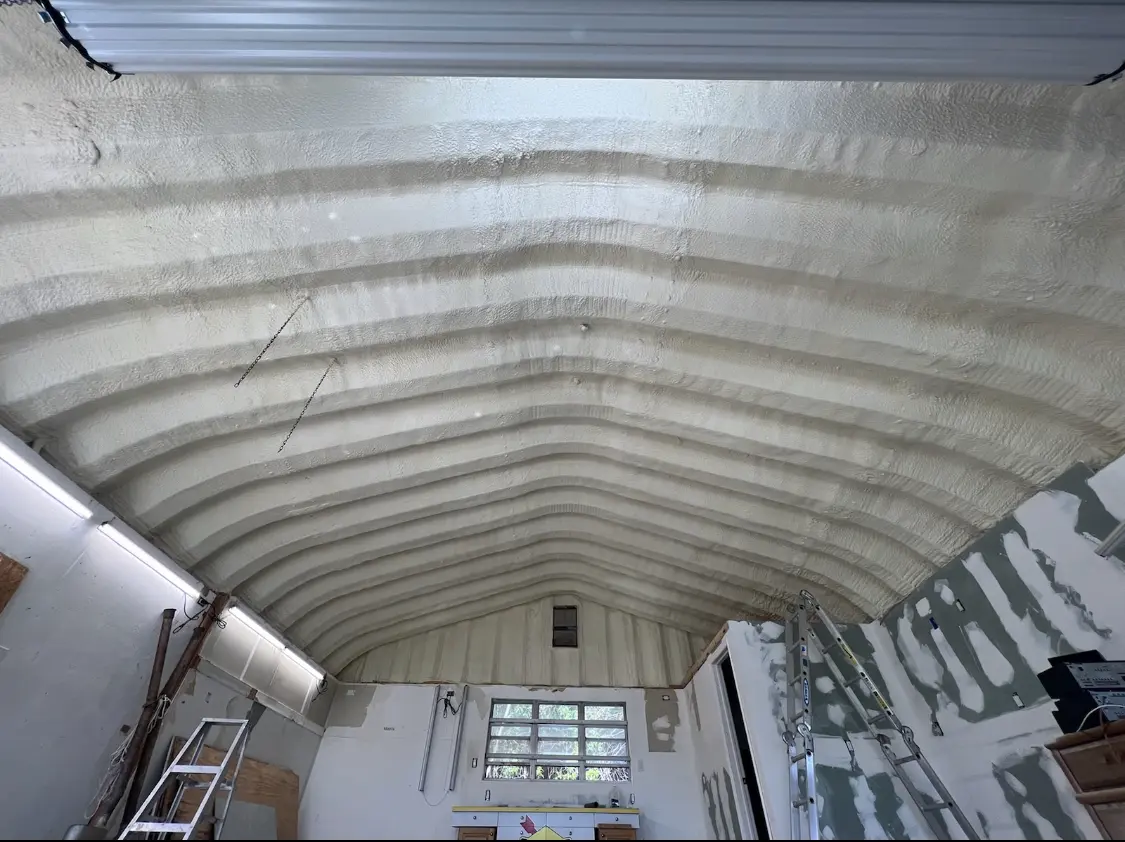 Spray polyurethane foam applied to the underside of a metal roof deck in Country Club Estates